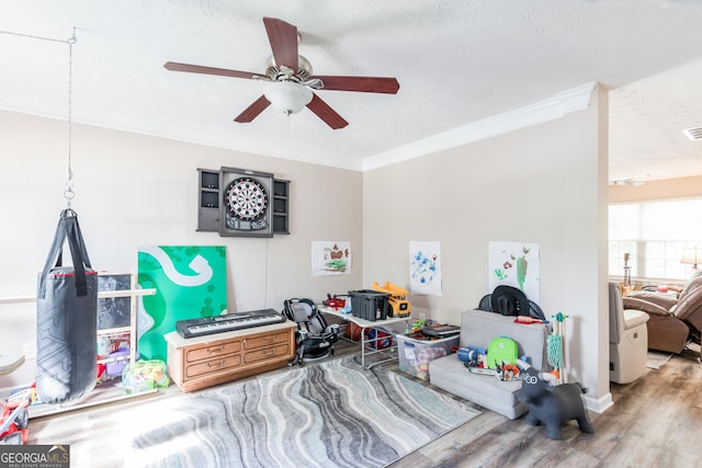 314 Meadows Ln, Canton, GA 30114 - playroom with a ceiling fan, wood finished floors, ornamental molding, and baseboards