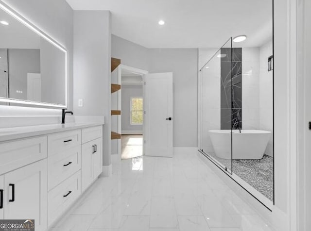 3312 Mill Forest Dr, Conyers, GA 30094 - full bathroom featuring a freestanding bath, vanity, marble finish floor, recessed lighting, and baseboards