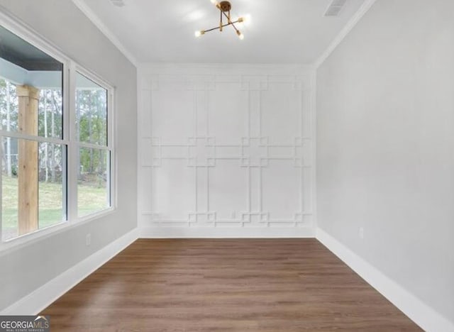 3312 Mill Forest Dr, Conyers, GA 30094 - spare room with baseboards, a notable chandelier, ornamental molding, and a healthy amount of sunlight