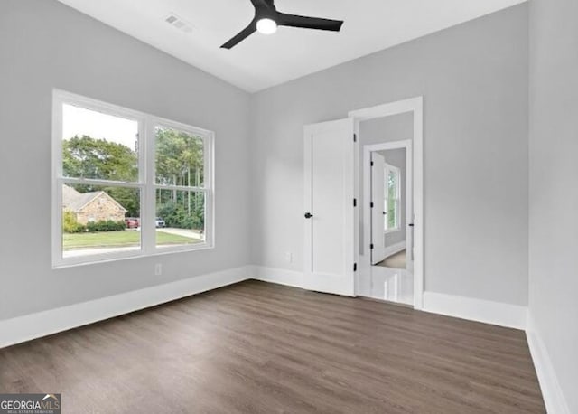 3312 Mill Forest Dr, Conyers, GA 30094 - spare room featuring baseboards, ceiling fan, visible vents, and dark wood finished floors