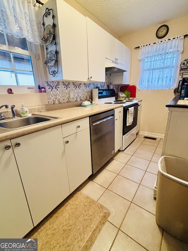 kitchen with electric stove, white cabinetry, under cabinet range hood, a sink, and dishwasher