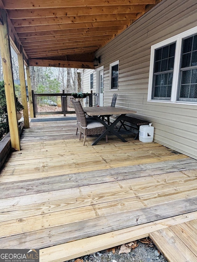 wooden deck with outdoor dining area