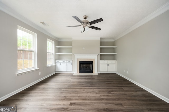 3230 Deer Valley Dr NW, Acworth, GA 30101 - unfurnished living room with a fireplace with raised hearth, ceiling fan, crown molding, baseboards, and dark wood-type flooring
