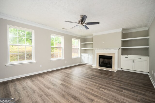 3230 Deer Valley Dr NW, Acworth, GA 30101 - unfurnished living room with a ceiling fan, a fireplace with raised hearth, dark wood-style floors, baseboards, and ornamental molding