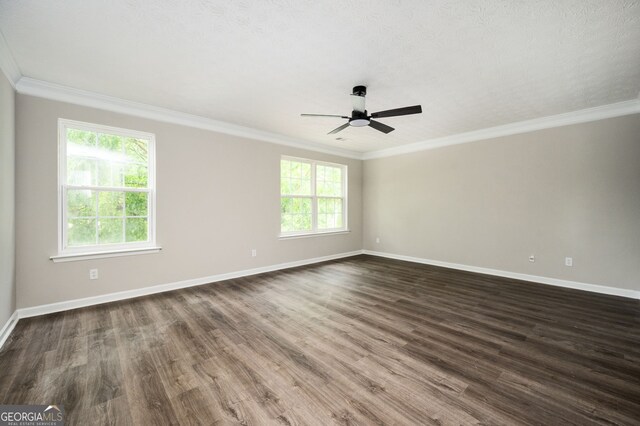 3230 Deer Valley Dr NW, Acworth, GA 30101 - spare room featuring baseboards, a ceiling fan, crown molding, and dark wood finished floors