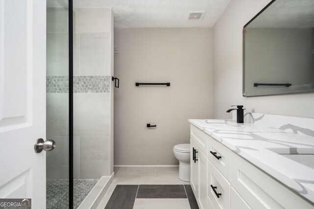 3230 Deer Valley Dr NW, Acworth, GA 30101 - bathroom with a shower stall, toilet, double vanity, tile patterned floors, and baseboards