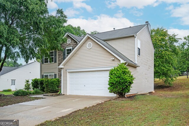 3230 Deer Valley Dr NW, Acworth, GA 30101 - traditional home featuring driveway, a chimney, a garage, a front lawn, and stone siding