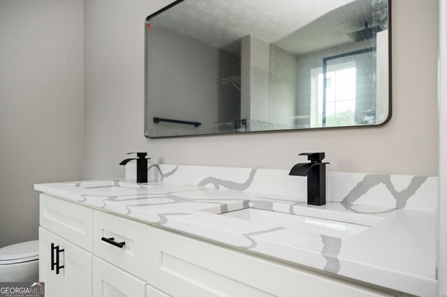 3230 Deer Valley Dr NW, Acworth, GA 30101 - full bathroom featuring double vanity and toilet