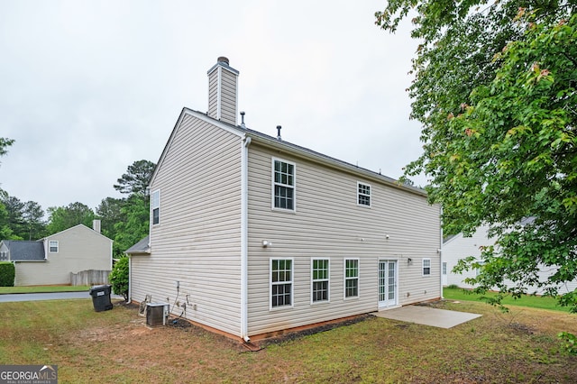 3230 Deer Valley Dr NW, Acworth, GA 30101 - rear view of property featuring a chimney, a yard, a patio, and cooling unit