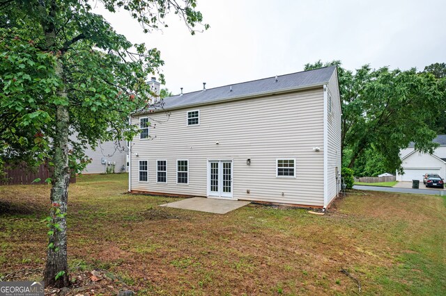 3230 Deer Valley Dr NW, Acworth, GA 30101 - back of property featuring french doors, a patio area, a yard, and a chimney