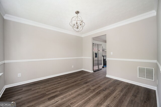 3230 Deer Valley Dr NW, Acworth, GA 30101 - unfurnished room with a chandelier, dark wood-style flooring, baseboards, ornamental molding, and a textured ceiling