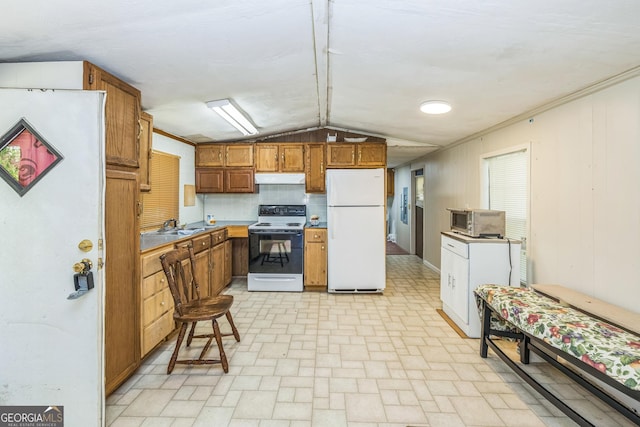 kitchen featuring electric range, a sink, freestanding refrigerator, lofted ceiling, and under cabinet range hood