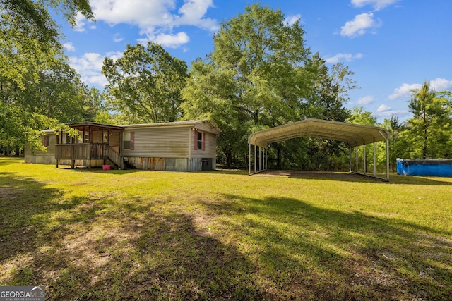 view of yard featuring a carport
