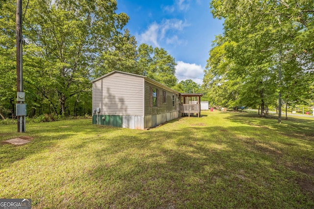 view of yard featuring a deck