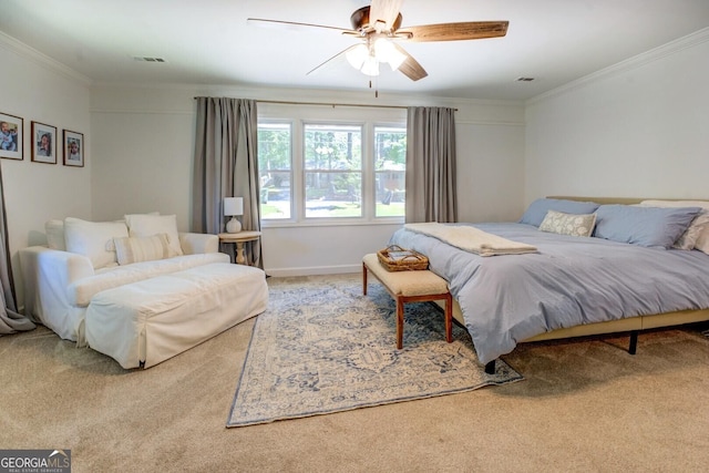 carpeted bedroom with crown molding, ceiling fan, visible vents, and baseboards