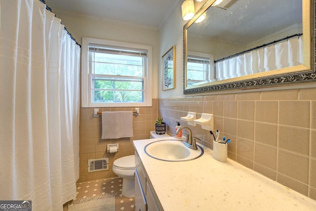 bathroom featuring visible vents, ornamental molding, a wealth of natural light, and toilet