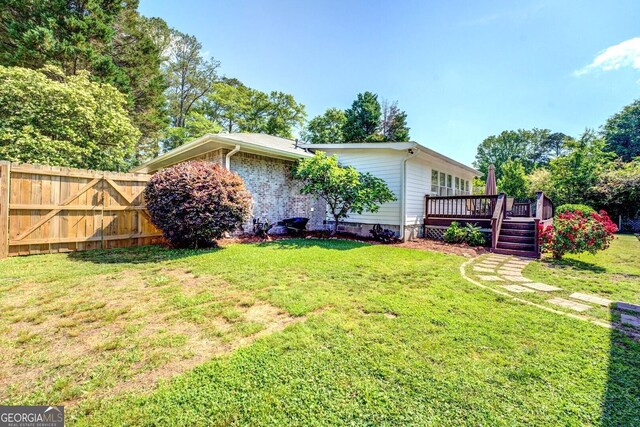 5327 David Cir SE, Covington, GA 30014 - view of yard featuring a deck