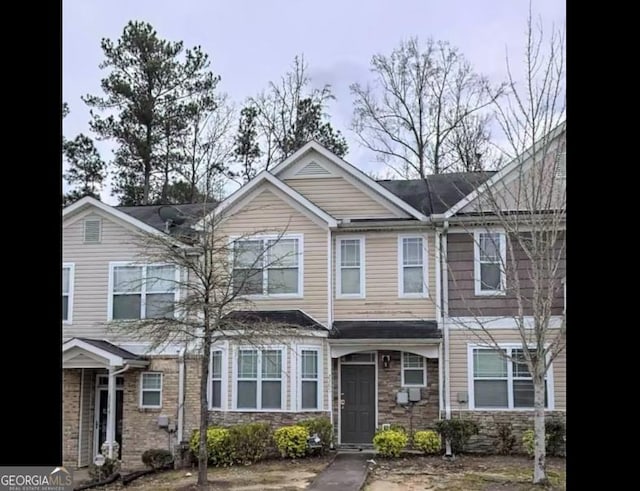 view of property with stone siding