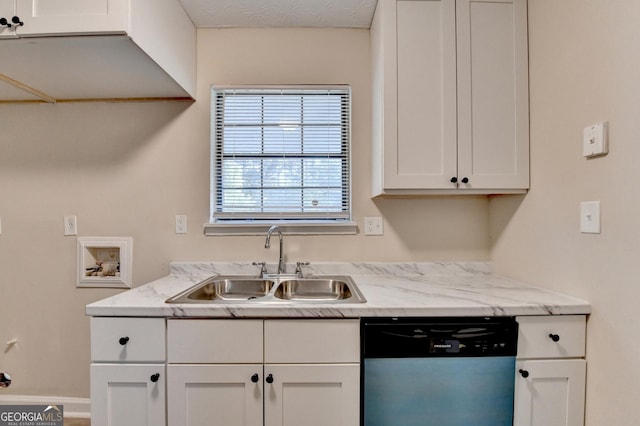 kitchen with light stone counters, a sink, dishwashing machine, and white cabinetry