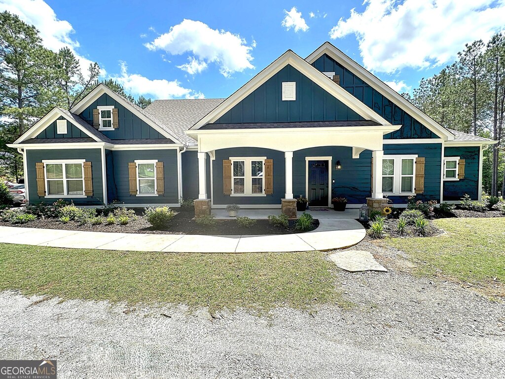 167 Burgess Rd, Lagrange, GA 30241 - craftsman house featuring board and batten siding, a porch, and a front yard