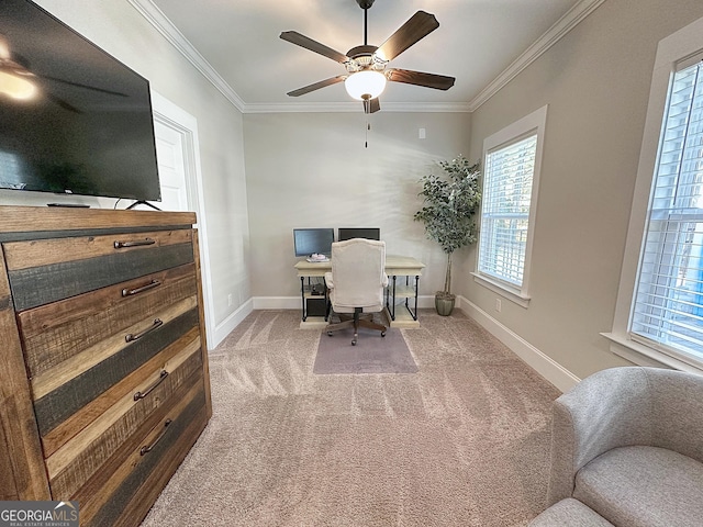 carpeted office featuring baseboards, ornamental molding, and ceiling fan