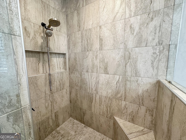 details featuring a tile shower