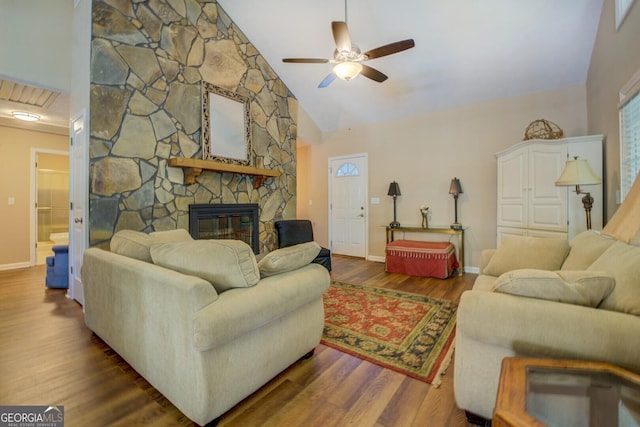 2787 Turtle Cove Trwy, Monticello, GA 31064 - living area featuring ceiling fan, a fireplace, baseboards, wood finished floors, and high vaulted ceiling