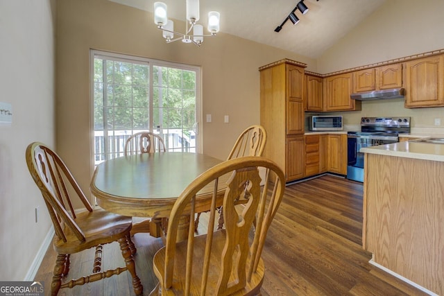 2787 Turtle Cove Trwy, Monticello, GA 31064 - kitchen featuring appliances with stainless steel finishes, under cabinet range hood, light countertops, vaulted ceiling, and a chandelier