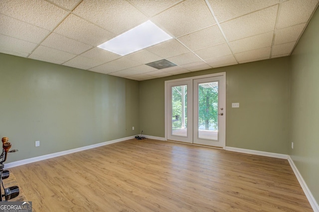 2787 Turtle Cove Trwy, Monticello, GA 31064 - empty room featuring a drop ceiling, light wood-style flooring, and baseboards