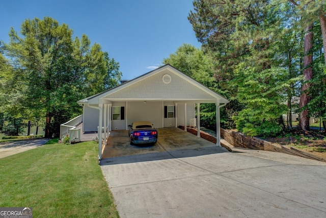 2787 Turtle Cove Trwy, Monticello, GA 31064 - view of front of house with concrete driveway, a front lawn, and a carport