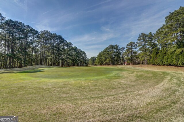 2787 Turtle Cove Trwy, Monticello, GA 31064 - view of home's community with view of golf course, a lawn, and view of wooded area