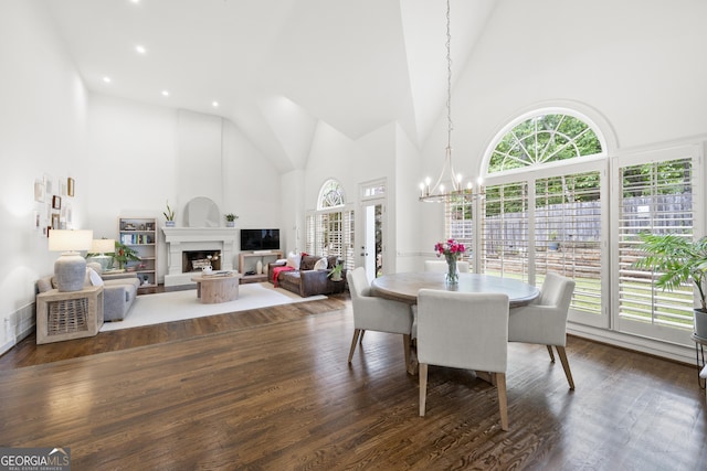 4503 Woodhaven NE, Marietta, GA 30067 - dining space featuring high vaulted ceiling, plenty of natural light, a chandelier, recessed lighting, and a large fireplace