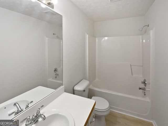 30 Trelawney Ct, Covington, GA 30016 - bathroom with shower / bathtub combination, toilet, a textured ceiling, and vanity