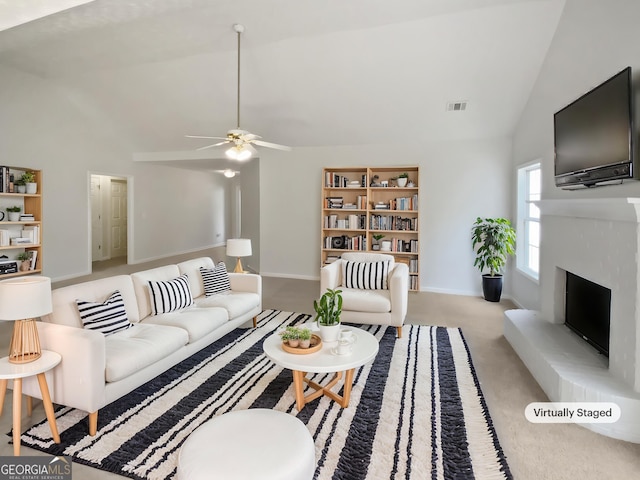 30 Trelawney Ct, Covington, GA 30016 - carpeted living room with a fireplace with raised hearth, high vaulted ceiling, a ceiling fan, baseboards, and visible vents