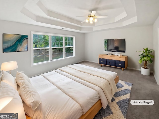 30 Trelawney Ct, Covington, GA 30016 - carpeted bedroom featuring baseboards, visible vents, ceiling fan, and a raised ceiling