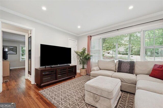 2586 Valley Stream Dr, Atlanta, GA 30360 - living room with wood finished floors, crown molding, and recessed lighting
