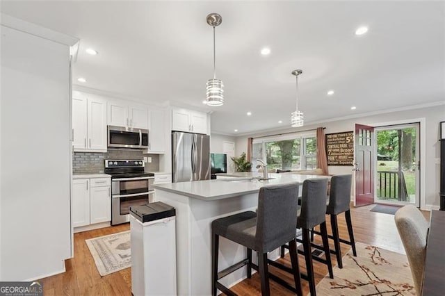 2586 Valley Stream Dr, Atlanta, GA 30360 - kitchen with appliances with stainless steel finishes, light countertops, recessed lighting, backsplash, and white cabinetry