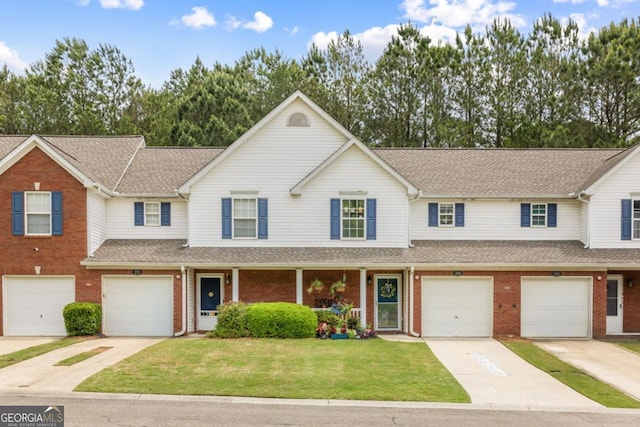 268 Cottonwood Creek Cir, Canton, GA 30114 - view of front of home featuring a shingled roof, an attached garage, and brick siding