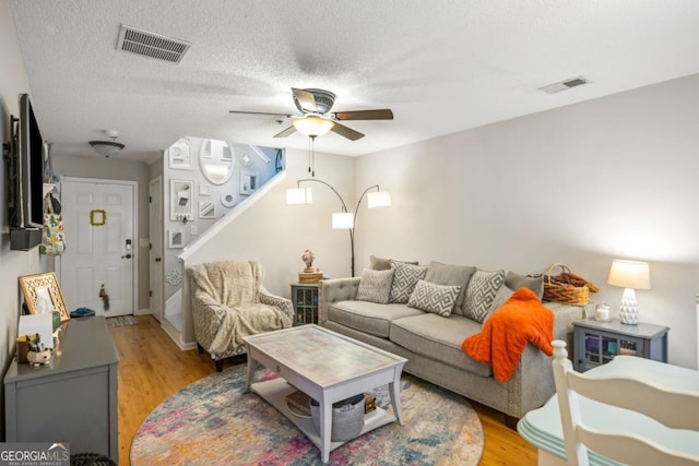 268 Cottonwood Creek Cir, Canton, GA 30114 - living area featuring a ceiling fan, visible vents, and light wood-style floors