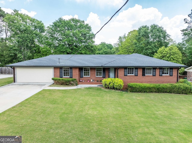 3089 Ranlo Dr, Atlanta, GA 30340 - single story home featuring a garage, a front yard, driveway, and brick siding