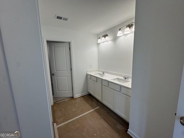 full bath featuring visible vents, a sink, concrete floors, and double vanity