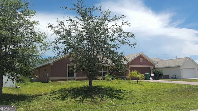 ranch-style house with a front yard, stucco siding, central AC unit, concrete driveway, and an attached garage