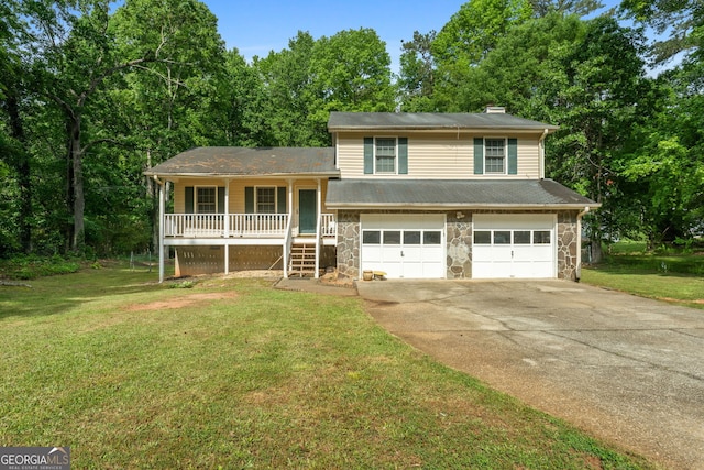 tri-level home with an attached garage, stone siding, a porch, a chimney, and driveway
