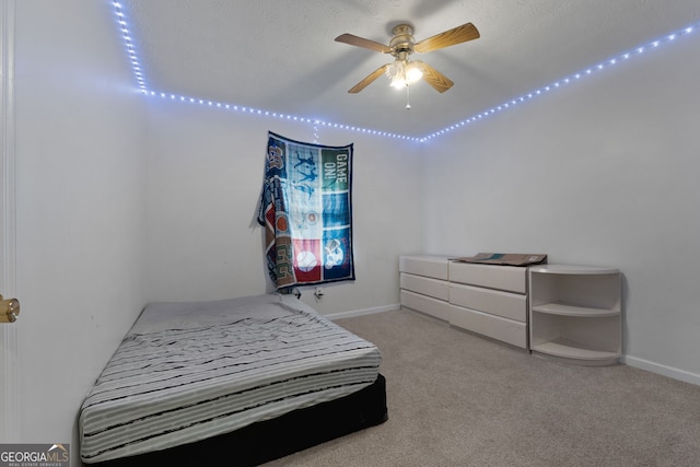 carpeted bedroom featuring baseboards