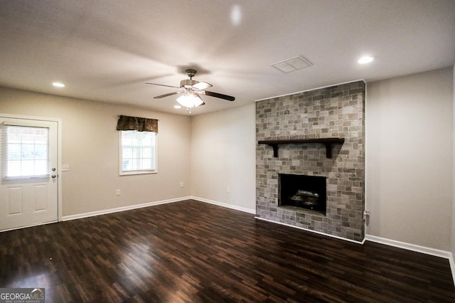 5034 W Ga Highway 292, Collins, GA 30421 - unfurnished living room with baseboards, ceiling fan, wood finished floors, and a fireplace