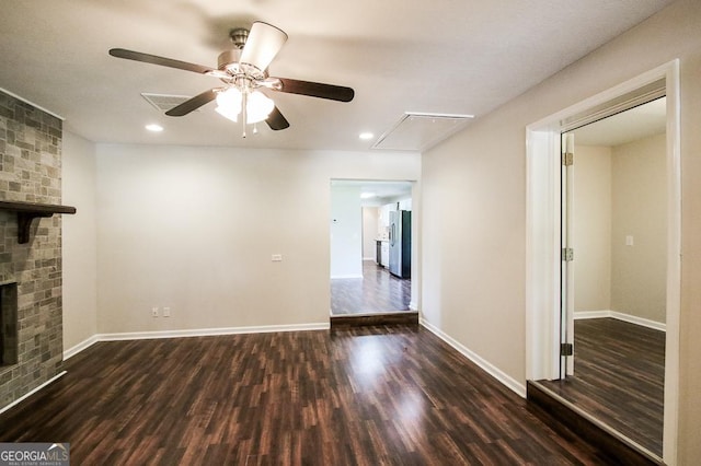 5034 W Ga Highway 292, Collins, GA 30421 - unfurnished living room featuring a ceiling fan, baseboards, dark wood finished floors, and attic access
