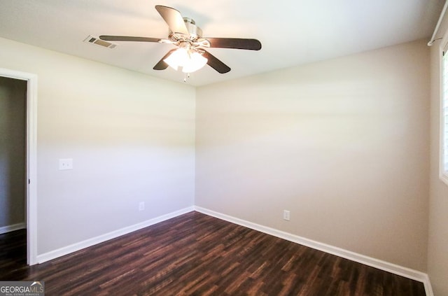 5034 W Ga Highway 292, Collins, GA 30421 - spare room with a ceiling fan, baseboards, visible vents, and dark wood-type flooring