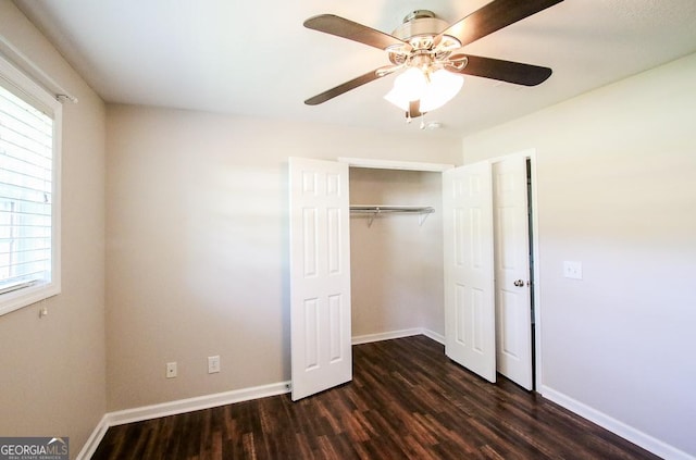5034 W Ga Highway 292, Collins, GA 30421 - unfurnished bedroom featuring a closet, dark wood-style flooring, baseboards, and multiple windows