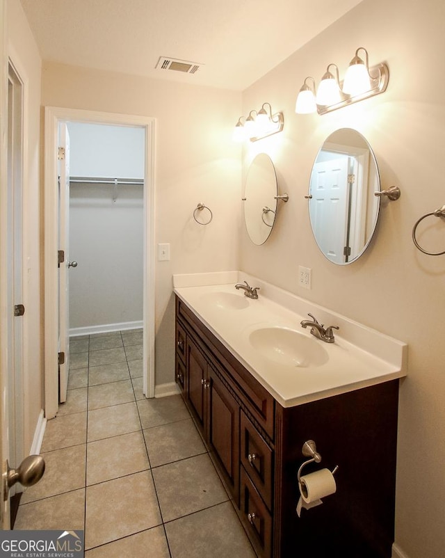 5034 W Ga Highway 292, Collins, GA 30421 - bathroom with a sink, tile patterned flooring, double vanity, and visible vents