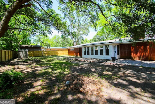 5034 W Ga Highway 292, Collins, GA 30421 - exterior space featuring an outdoor structure, fence, and a storage shed